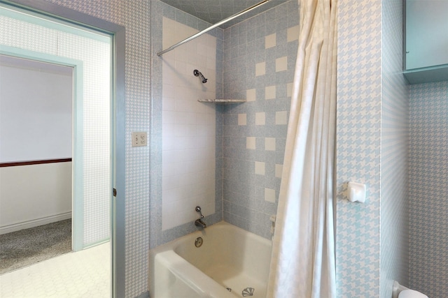 bathroom with shower / bathtub combination with curtain