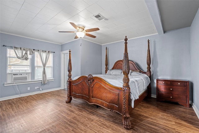 bedroom featuring wood finished floors, visible vents, and baseboards