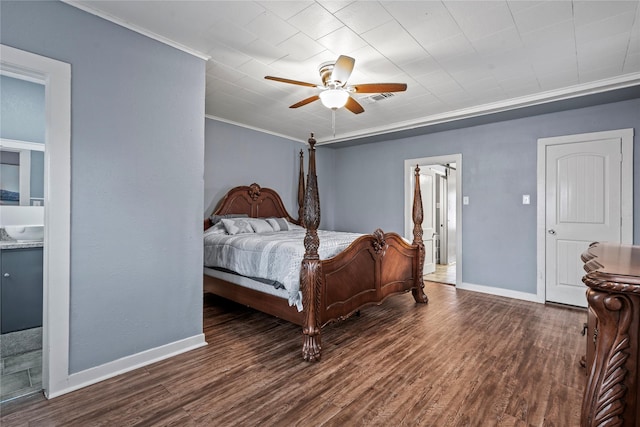 bedroom with ceiling fan, wood finished floors, visible vents, baseboards, and crown molding