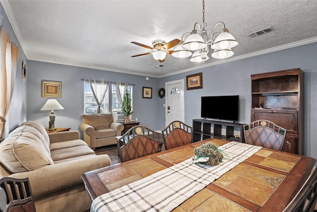 dining space featuring crown molding, visible vents, a textured ceiling, cooling unit, and ceiling fan with notable chandelier