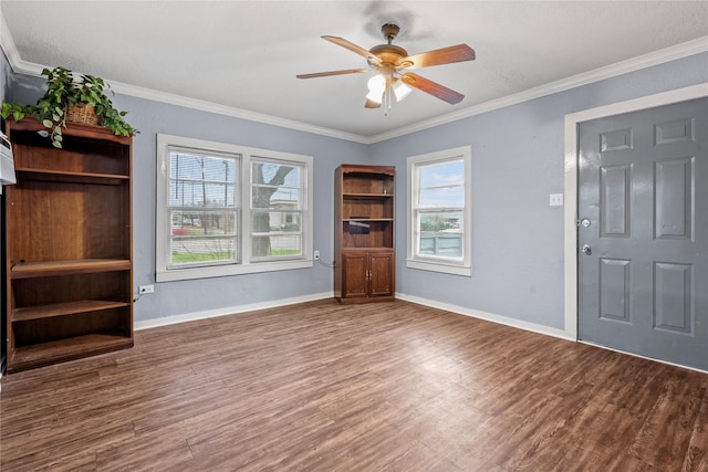 foyer entrance featuring ceiling fan, ornamental molding, wood finished floors, and baseboards