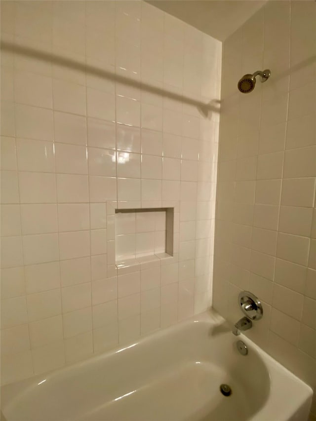 bathroom with bathing tub / shower combination