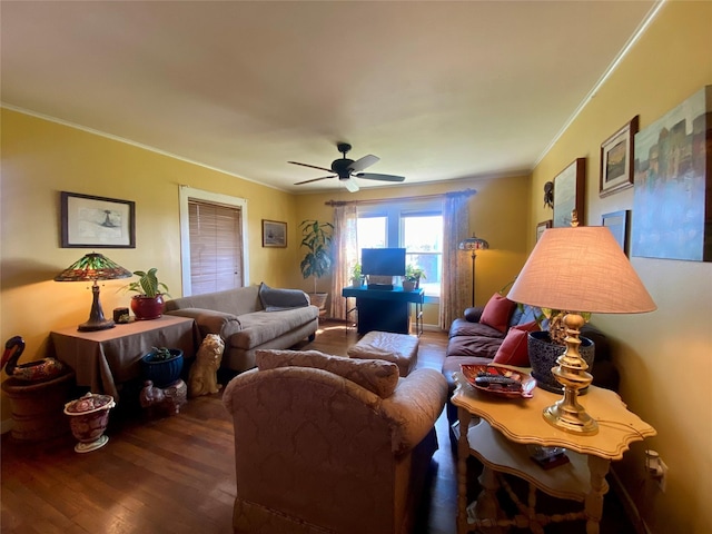 living area featuring wood finished floors, a ceiling fan, and crown molding