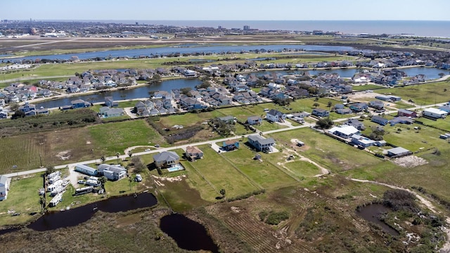 birds eye view of property with a residential view and a water view