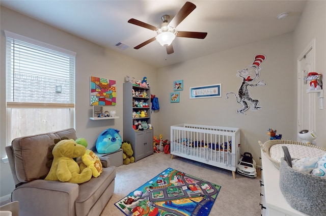 bedroom featuring visible vents, carpet flooring, and a ceiling fan