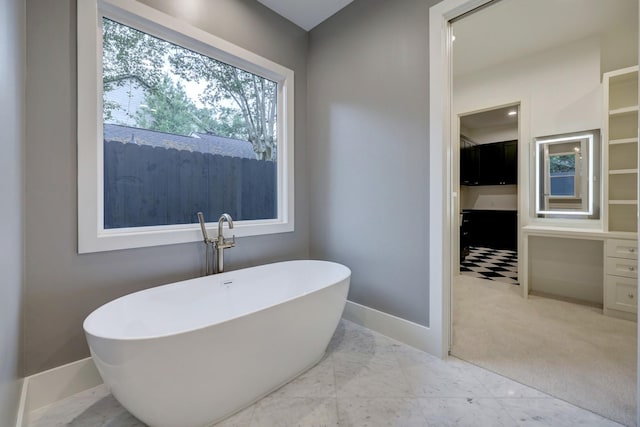 1614 Woodcrest Dr, Houston, TX 77018 - full bathroom featuring a soaking tub, baseboards, and marble finish flooring