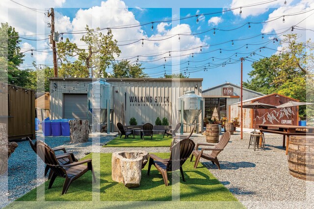 1614 Woodcrest Dr, Houston, TX 77018 - view of yard featuring an outdoor fire pit and an outdoor structure