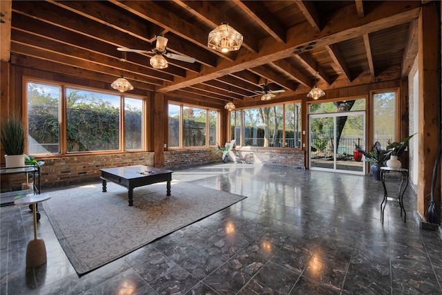 unfurnished sunroom featuring ceiling fan and beam ceiling