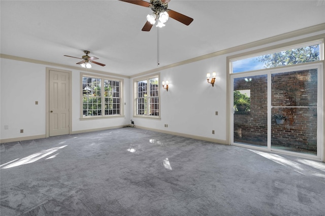 unfurnished living room featuring crown molding, carpet floors, ceiling fan, and baseboards