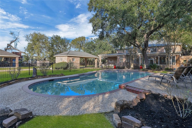 view of pool featuring fence, a fenced in pool, and a patio