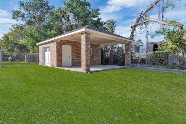 exterior space featuring driveway, a lawn, a patio, fence, and a carport