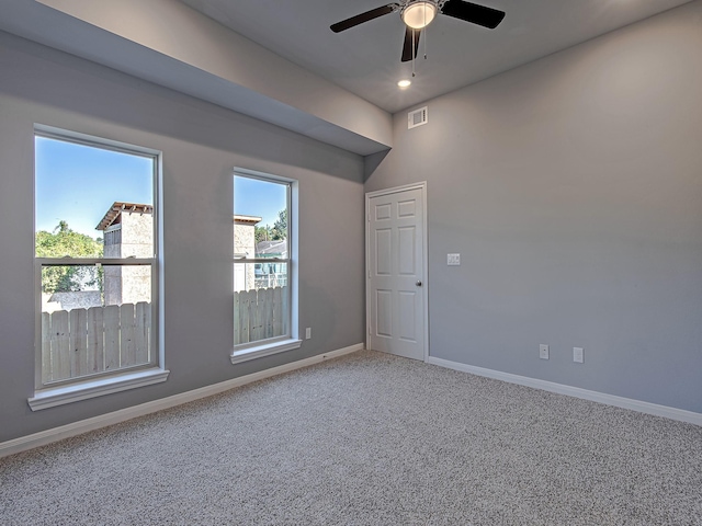 unfurnished room with carpet floors, recessed lighting, visible vents, ceiling fan, and baseboards