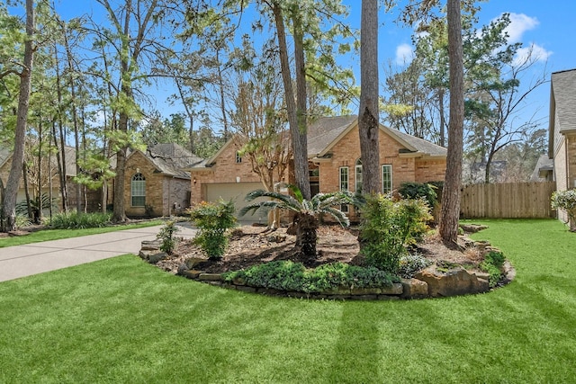 single story home featuring driveway, a garage, fence, a front lawn, and brick siding