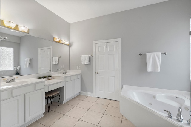 full bath featuring double vanity, a sink, a jetted tub, and tile patterned floors