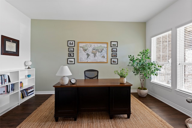 home office with baseboards and dark wood finished floors