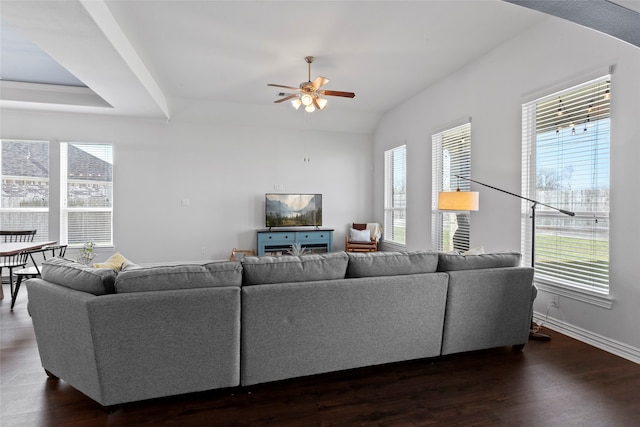 living room with dark wood-style floors and a wealth of natural light