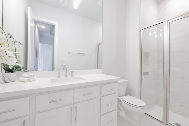 full bath with marble finish floor, toilet, vanity, and a marble finish shower