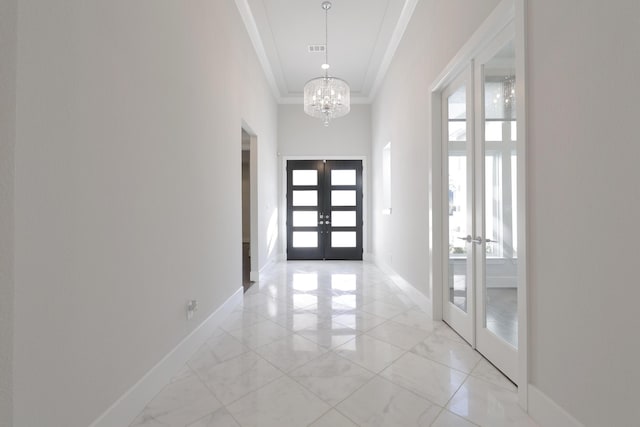 entryway featuring visible vents, baseboards, marble finish floor, crown molding, and french doors