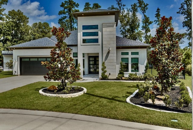 view of front of home with a garage, concrete driveway, fence, french doors, and stucco siding