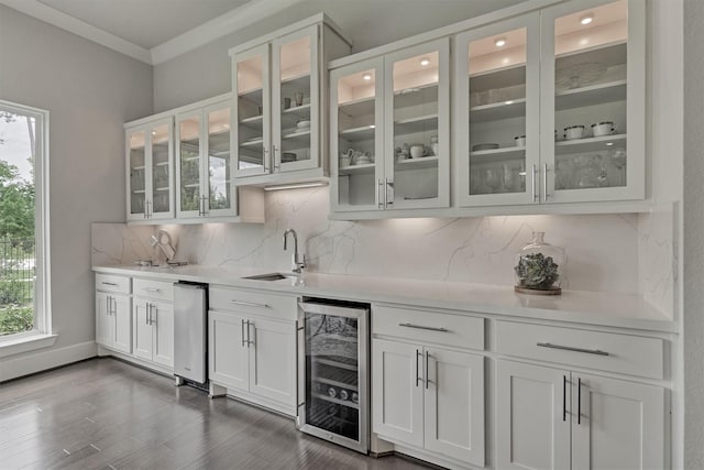 35 Papado Trails Cir, The Woodlands, TX 77375 - indoor wet bar with wine cooler, plenty of natural light, tasteful backsplash, dark wood-style flooring, and ornamental molding