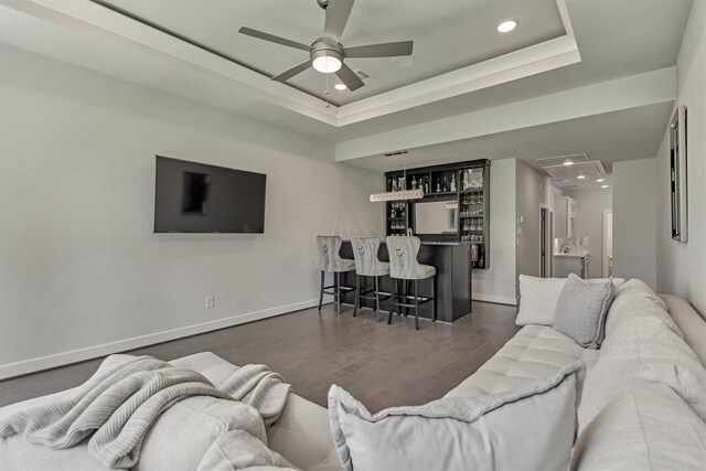 35 Papado Trails Cir, The Woodlands, TX 77375 - living room with recessed lighting, a ceiling fan, bar area, a raised ceiling, and wood finished floors