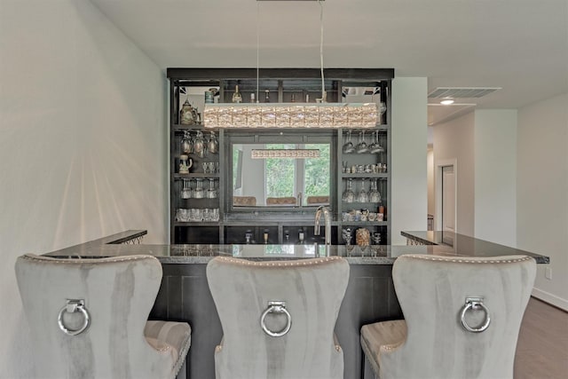 35 Papado Trails Cir, The Woodlands, TX 77375 - indoor wet bar with wood finished floors and baseboards