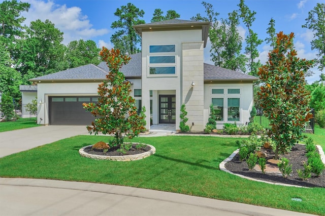 35 Papado Trails Cir, The Woodlands, TX 77375 - contemporary house featuring an attached garage, driveway, stucco siding, and french doors