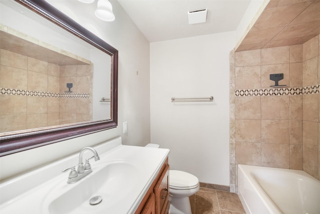 full bath featuring toilet, tile patterned flooring, vanity, and baseboards