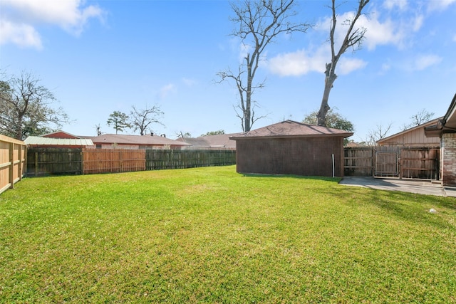 view of yard with a fenced backyard