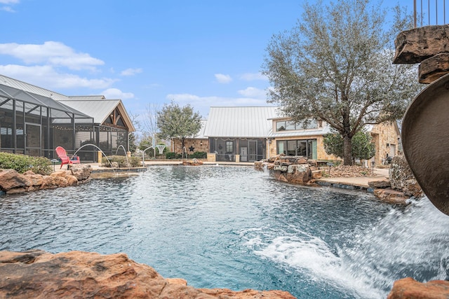 view of pool with a lanai and a patio area