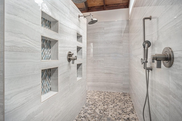 full bathroom with a tile shower