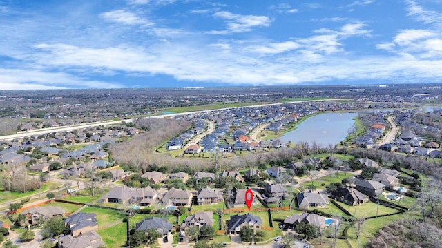 birds eye view of property featuring a residential view and a water view