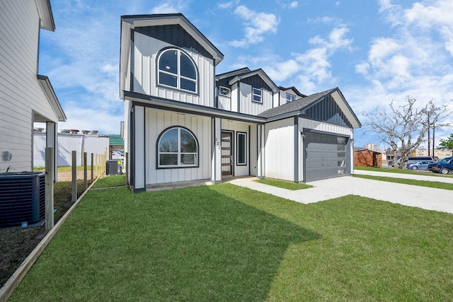 modern farmhouse style home with concrete driveway, central AC unit, a front lawn, and board and batten siding