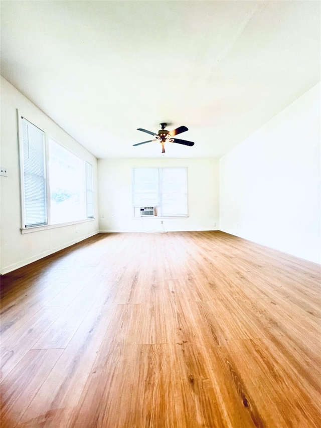 unfurnished living room with light wood finished floors and a ceiling fan