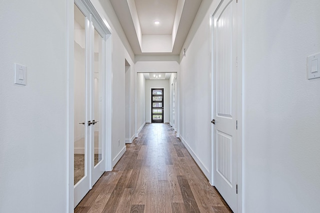 209 Peninsula Point Dr, Montgomery, TX 77356 - hall with baseboards, french doors, wood finished floors, and a raised ceiling