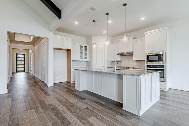 209 Peninsula Point Dr, Montgomery, TX 77356 - kitchen with white cabinets, built in microwave, stainless steel oven, visible vents, and dark wood-type flooring