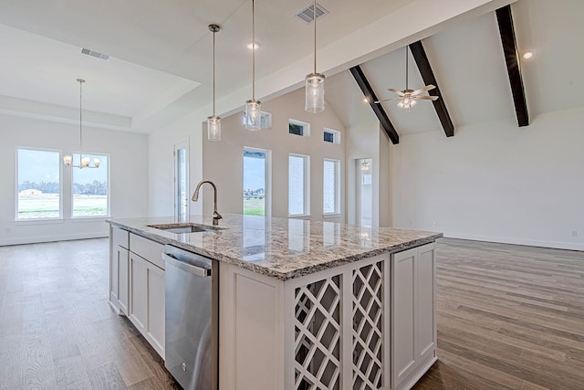209 Peninsula Point Dr, Montgomery, TX 77356 - kitchen with open floor plan, visible vents, stainless steel dishwasher, and a sink