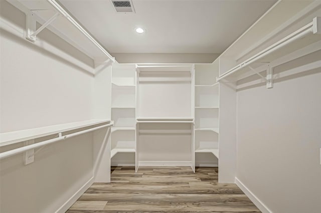 2111 Nina Lee Ln, Houston, TX 77018 - spacious closet featuring wood finished floors and visible vents