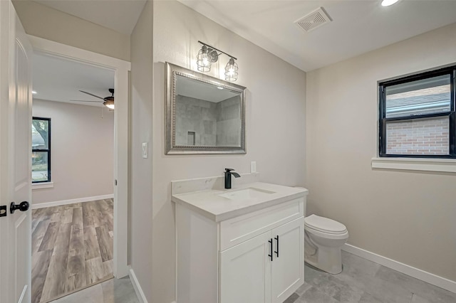 2111 Nina Lee Ln, Houston, TX 77018 - bathroom with a wealth of natural light, visible vents, ceiling fan, and vanity
