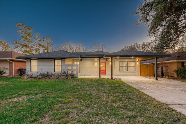 2111 Nina Lee Ln, Houston, TX 77018 - view of front of property featuring a front yard, fence, brick siding, and concrete driveway