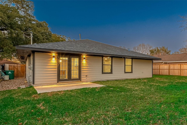 2111 Nina Lee Ln, Houston, TX 77018 - back of house with a lawn, fence, french doors, and roof with shingles