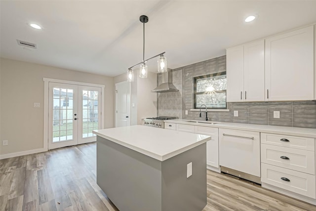 2111 Nina Lee Ln, Houston, TX 77018 - kitchen featuring range, backsplash, a sink, visible vents, and wall chimney range hood