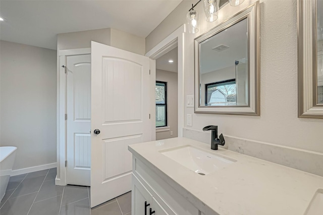 2111 Nina Lee Ln, Houston, TX 77018 - full bathroom featuring a freestanding tub, tile patterned floors, vanity, baseboards, and visible vents