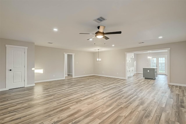 2111 Nina Lee Ln, Houston, TX 77018 - unfurnished living room with baseboards, visible vents, light wood-style flooring, and ceiling fan