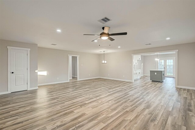 2111 Nina Lee Ln, Houston, TX 77018 - unfurnished living room with light wood-type flooring, baseboards, ceiling fan, and visible vents