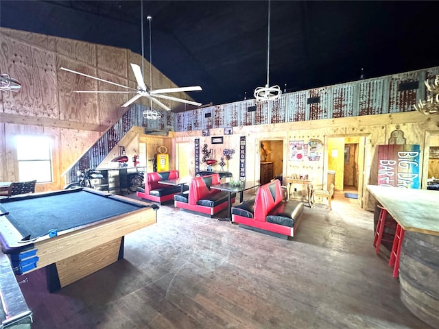 playroom featuring pool table, ceiling fan, and a high ceiling