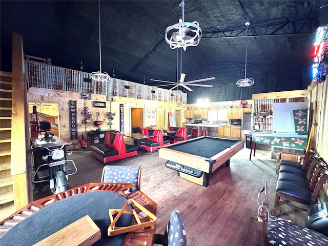 game room featuring high vaulted ceiling, pool table, and wood finished floors