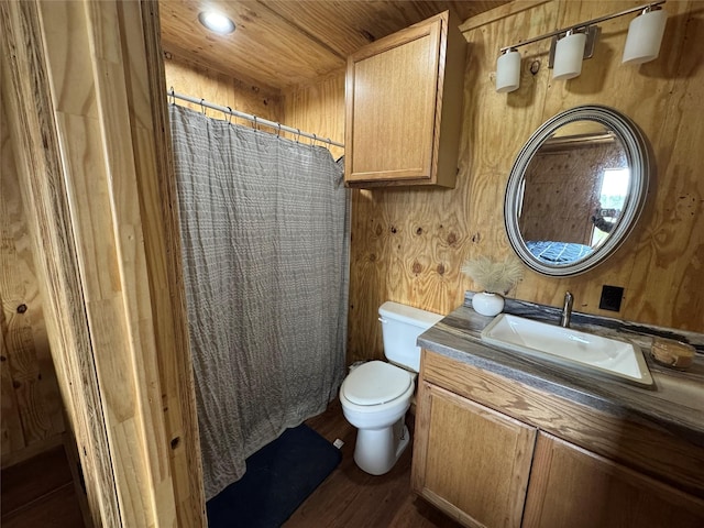 bathroom with toilet, recessed lighting, wood finished floors, vanity, and a shower with curtain