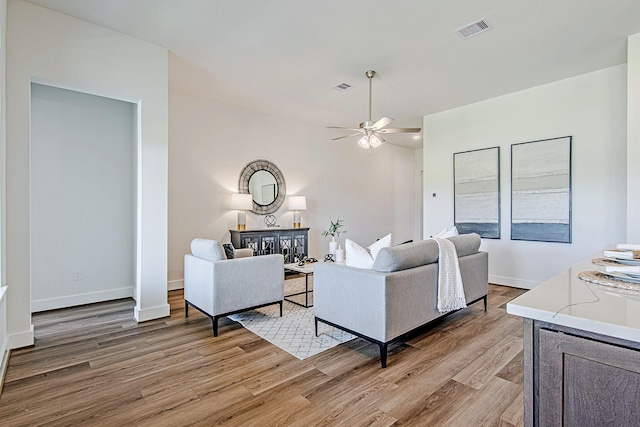 187 Peninsula Point Dr, Montgomery, TX 77356 - living room featuring light wood-type flooring, a ceiling fan, and baseboards