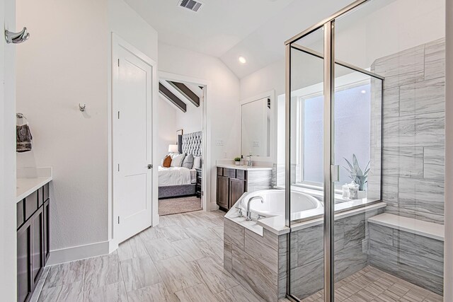 187 Peninsula Point Dr, Montgomery, TX 77356 - bathroom featuring ensuite bath, a bath, a stall shower, vaulted ceiling, and vanity